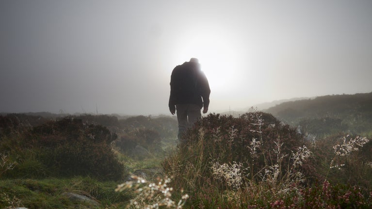 Visitor walking in the mist at Ennerdale, Cumbria